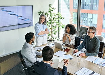 Business colleagues speaking to each other