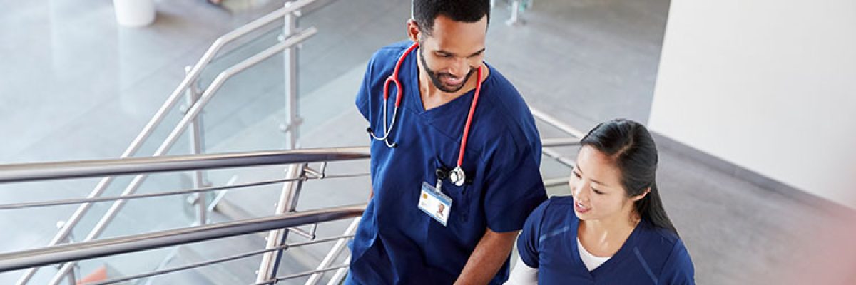 Two nurses walking and talking