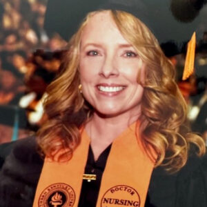 Dr. Jennifer Hunter in cap and gown at graduation